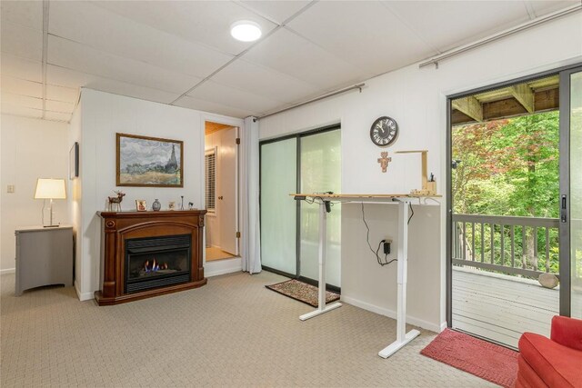 47 Red Bud Ct, Sapphire, NC 28774 - interior space featuring a lit fireplace, baseboards, and a drop ceiling