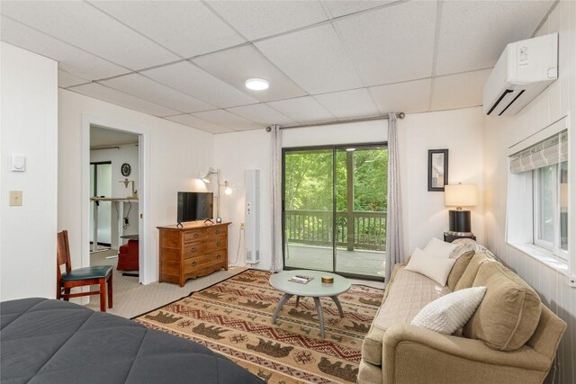 47 Red Bud Ct, Sapphire, NC 28774 - carpeted living area with an AC wall unit and a paneled ceiling