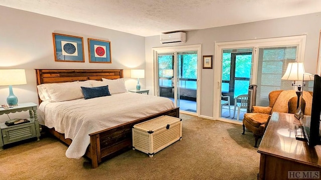 carpeted bedroom featuring a textured ceiling, access to exterior, and a wall unit AC