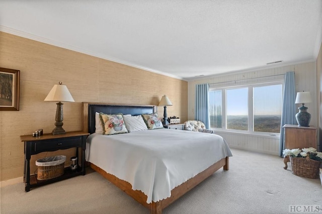 bedroom with crown molding and carpet flooring