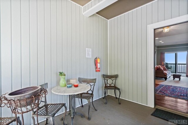 interior space featuring wooden walls