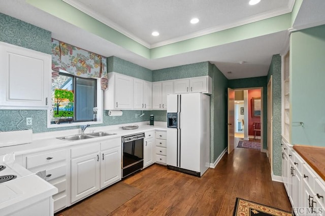 kitchen with white cabinetry, sink, white fridge with ice dispenser, and dishwasher