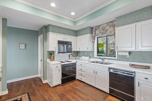 kitchen featuring sink, dark wood-type flooring, white cabinets, and black appliances