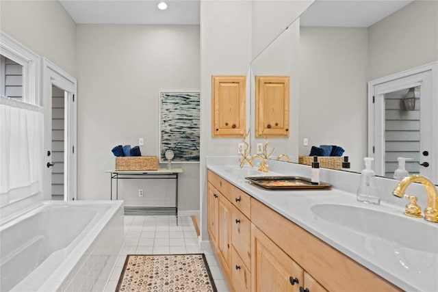 full bath featuring tile patterned flooring, double vanity, a bath, and a sink