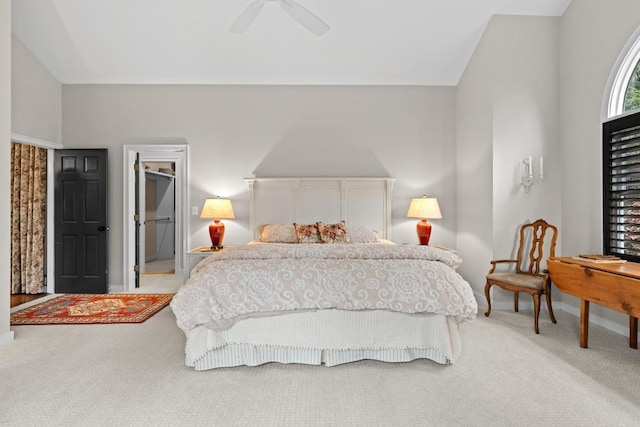 bedroom featuring baseboards, a ceiling fan, carpet, and vaulted ceiling