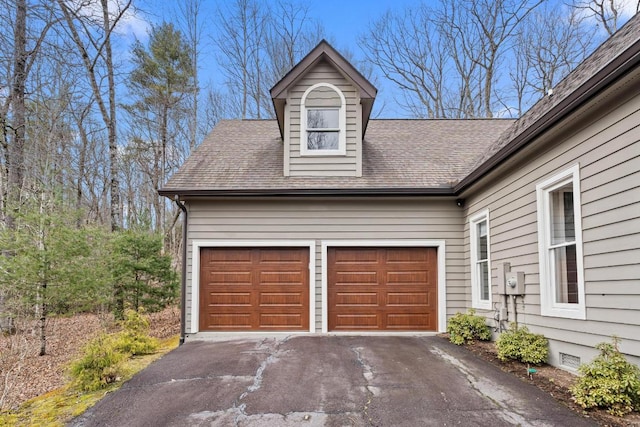 garage featuring driveway