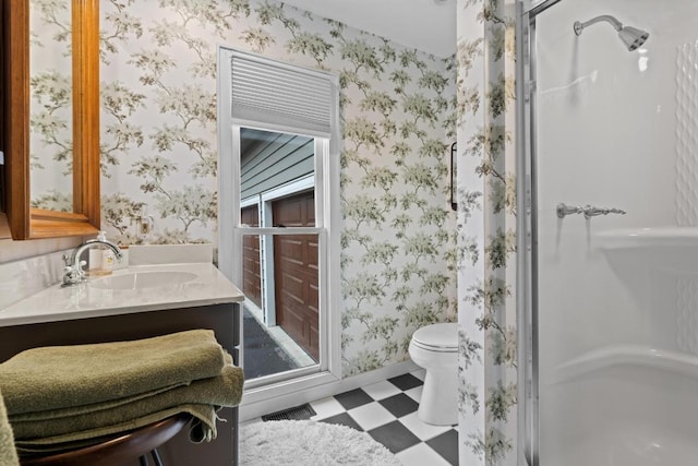 bathroom with tile patterned floors, visible vents, toilet, a shower stall, and wallpapered walls