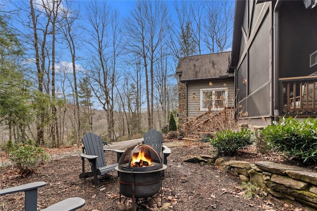 view of yard with an outdoor fire pit