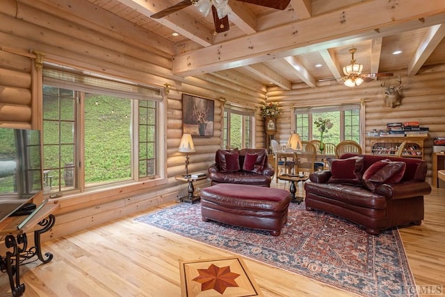 living room with hardwood / wood-style flooring, log walls, ceiling fan, and beamed ceiling