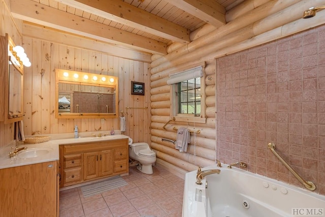 bathroom with rustic walls, a bathtub, vanity, toilet, and beamed ceiling