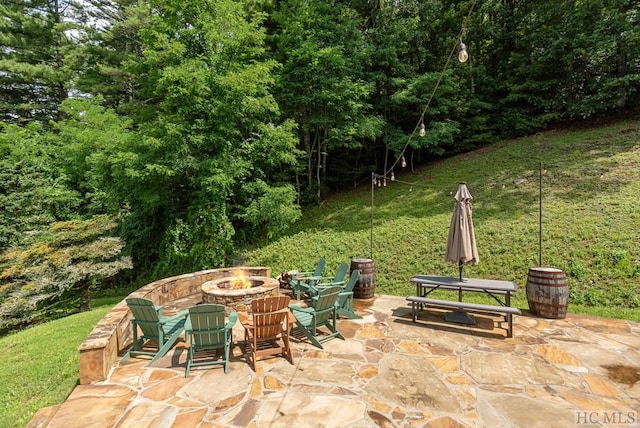 view of patio featuring an outdoor fire pit