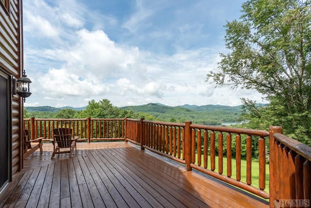 wooden terrace featuring a mountain view