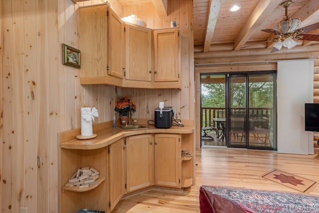 bar with log walls, light hardwood / wood-style floors, and wood ceiling