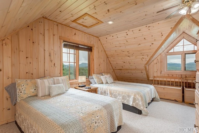 bedroom with wooden walls, lofted ceiling, carpet, ceiling fan, and wooden ceiling