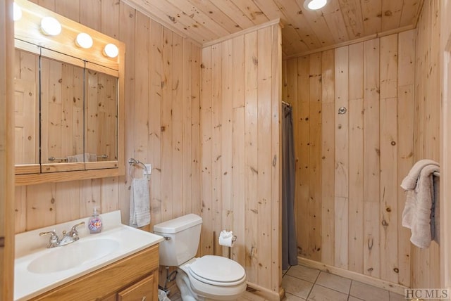 bathroom with vanity, tile patterned flooring, wooden ceiling, and wood walls