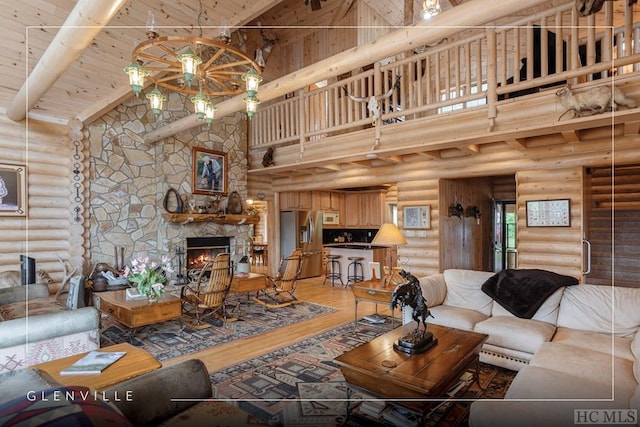 living room featuring a stone fireplace, high vaulted ceiling, rustic walls, and wooden ceiling