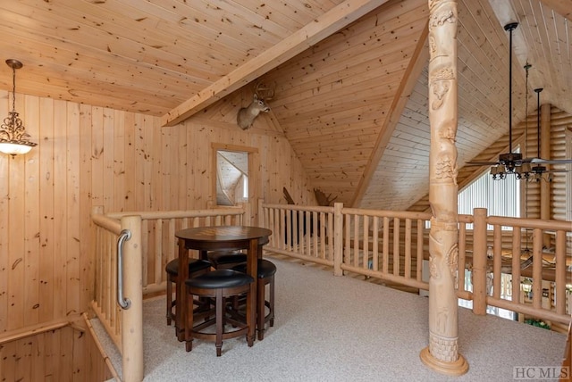 interior space featuring wood ceiling, a healthy amount of sunlight, lofted ceiling with beams, and light carpet