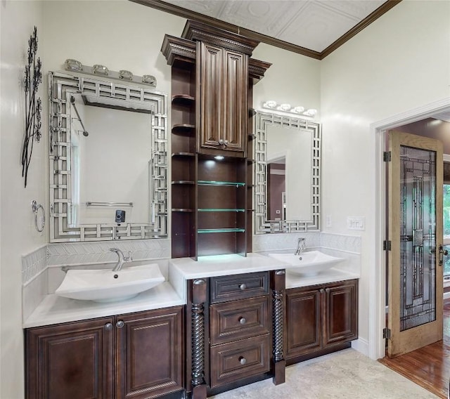 bathroom with vanity and ornamental molding