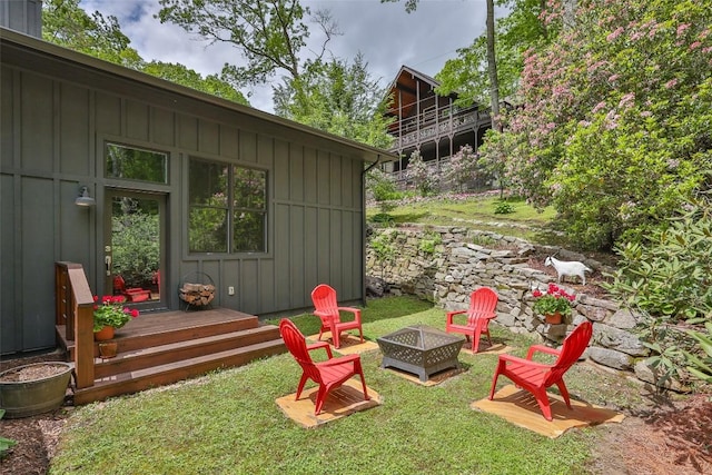 226 Sky Lake Dr, Highlands, NC 28741 - view of grassy yard featuring an outdoor fire pit and a deck