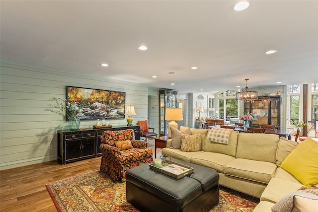226 Sky Lake Dr, Highlands, NC 28741 - living room featuring recessed lighting, plenty of natural light, wood finished floors, a chandelier, and wooden walls