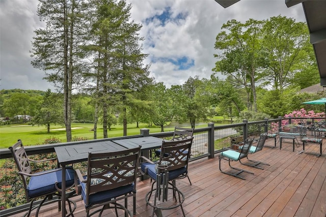 226 Sky Lake Dr, Highlands, NC 28741 - deck featuring outdoor dining space, a lawn, and view of wooded area