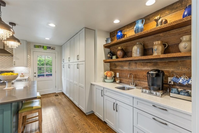 226 Sky Lake Dr, Highlands, NC 28741 - indoor wet bar with dark wood-style flooring, recessed lighting, backsplash, and hanging light fixtures