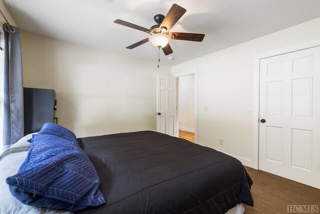 carpeted bedroom with ceiling fan