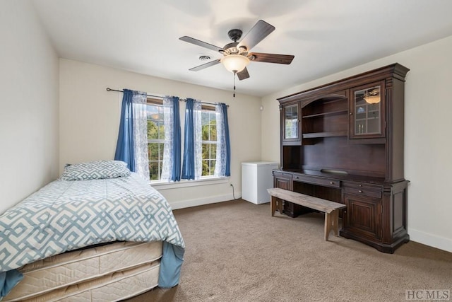 bedroom with ceiling fan and carpet floors