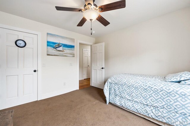 carpeted bedroom with ceiling fan