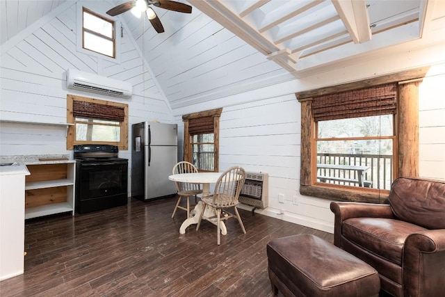 dining room featuring a wall unit AC, plenty of natural light, and dark wood-style flooring