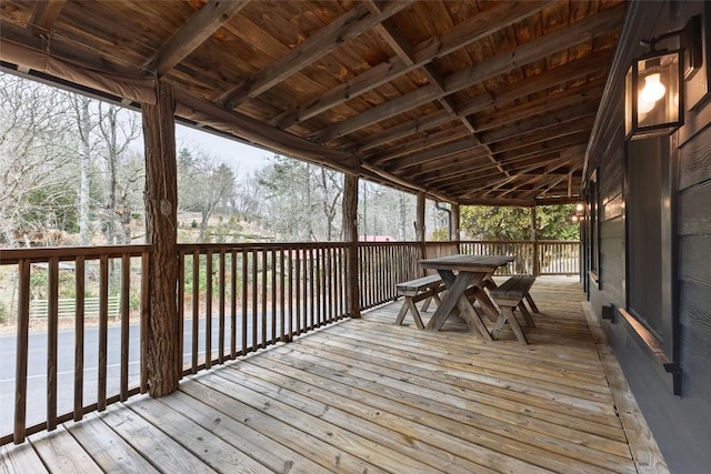 wooden terrace featuring outdoor dining area