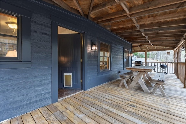 wooden deck with outdoor dining area