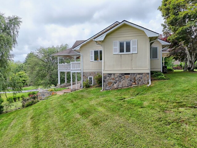 70 Fairway Ln, Sky Valley, GA 30537 - rear view of house with a lawn and a balcony