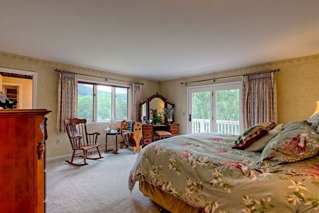 70 Fairway Ln, Sky Valley, GA 30537 - carpeted bedroom featuring access to exterior, multiple windows, and wallpapered walls