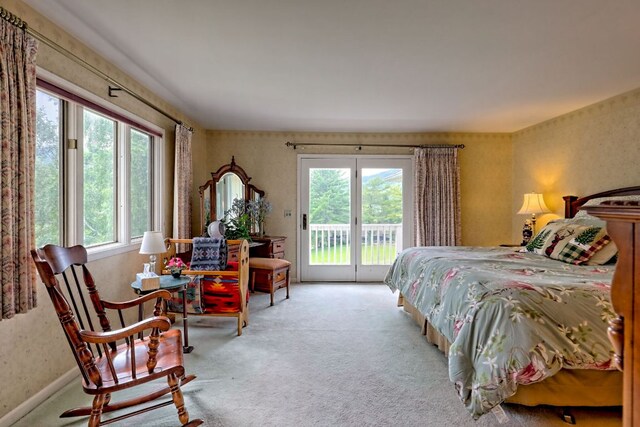 70 Fairway Ln, Sky Valley, GA 30537 - carpeted bedroom featuring multiple windows, access to exterior, and wallpapered walls