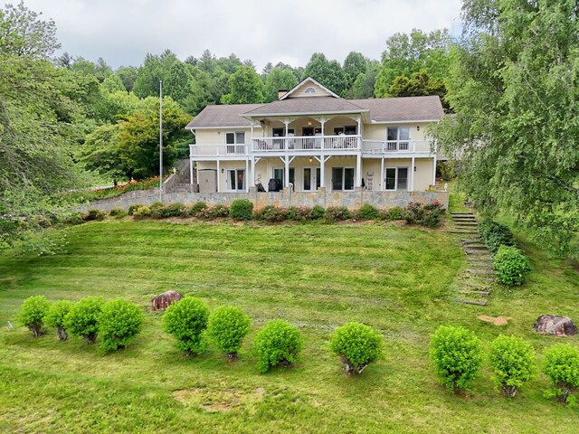 70 Fairway Ln, Sky Valley, GA 30537 - view of front of home with stairs, a view of trees, and a front lawn