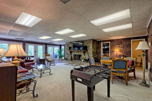 70 Fairway Ln, Sky Valley, GA 30537 - game room with carpet, a paneled ceiling, plenty of natural light, and a stone fireplace