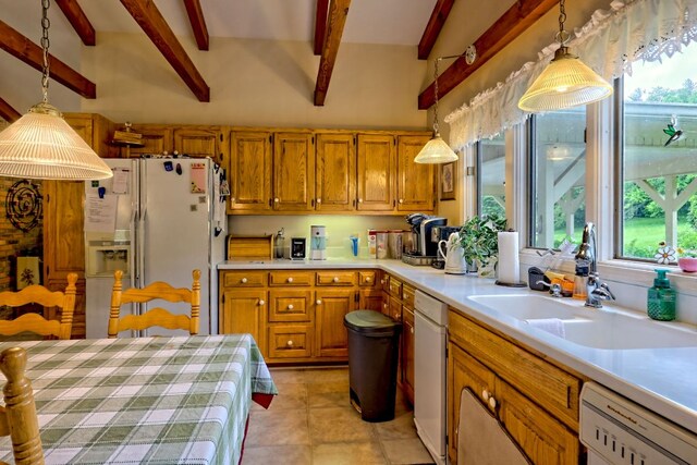 70 Fairway Ln, Sky Valley, GA 30537 - kitchen featuring white appliances, beamed ceiling, decorative light fixtures, light countertops, and brown cabinets