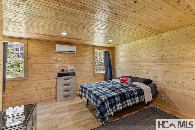 210 Triple Fork Rd, Cullowhee, NC 28723 - bedroom featuring an AC wall unit, wooden walls, multiple windows, wood ceiling, and wood finished floors