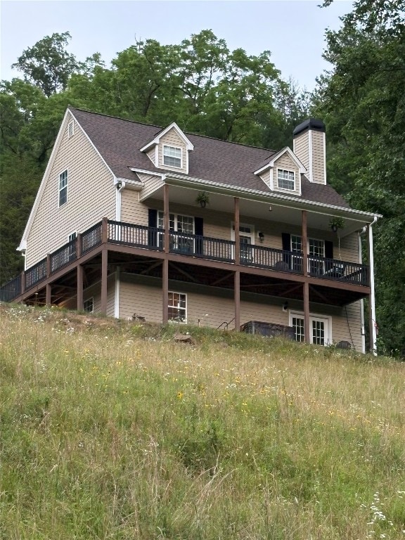 210 Triple Fork Rd, Cullowhee, NC 28723 - back of house with a chimney, a deck, and a shingled roof