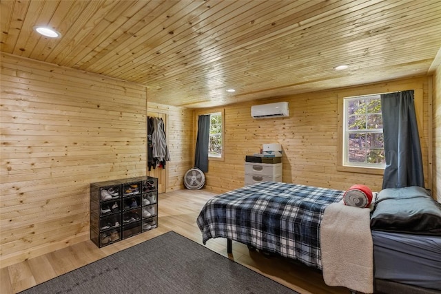 210 Triple Fork Rd, Cullowhee, NC 28723 - bedroom with a wall mounted air conditioner, wooden ceiling, wood walls, wood finished floors, and recessed lighting