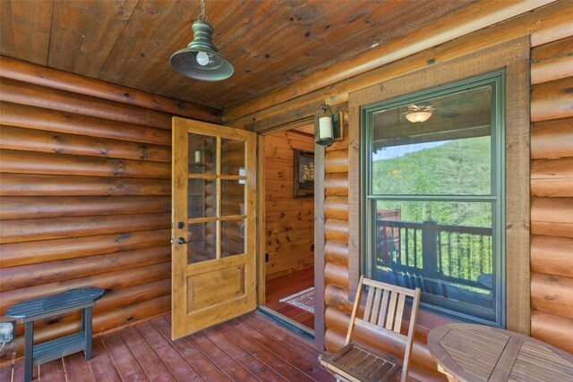 1318 Shortoff Rd, Highlands, NC 28741 - doorway to outside with rustic walls, wooden ceiling, and dark wood-style floors