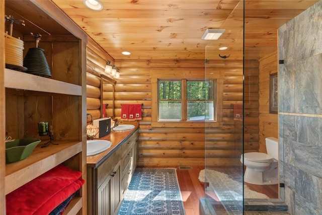 1318 Shortoff Rd, Highlands, NC 28741 - bathroom featuring rustic walls, wood finished floors, double vanity, wooden ceiling, and toilet