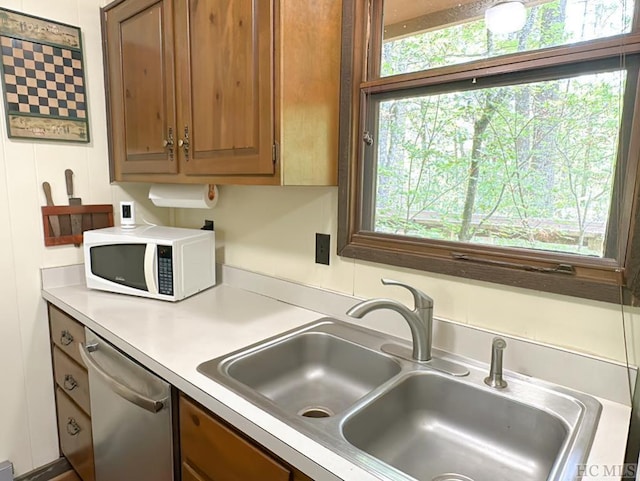 kitchen featuring sink and stainless steel dishwasher