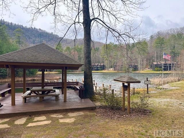 exterior space with a gazebo and a water and mountain view