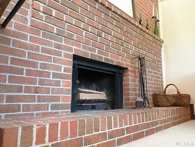 details featuring a brick fireplace