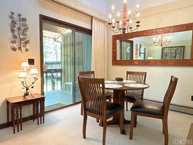 dining space featuring a chandelier and light carpet