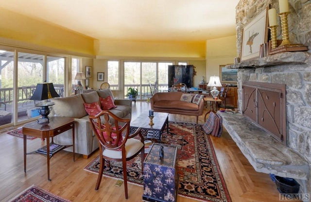 living room with a fireplace and light hardwood / wood-style floors