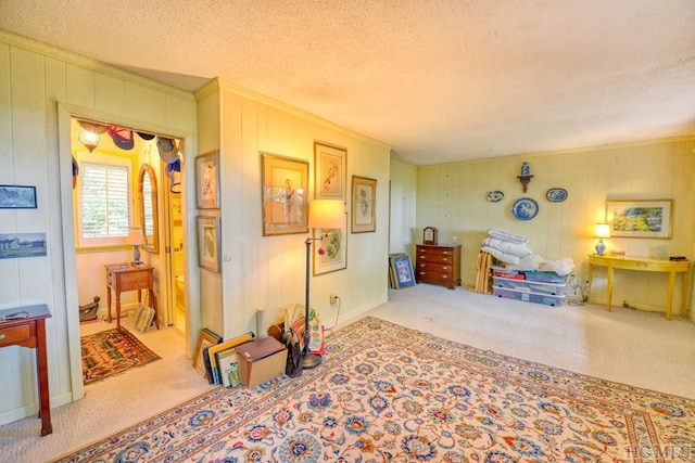 interior space with ornamental molding, carpet flooring, wooden walls, and a textured ceiling