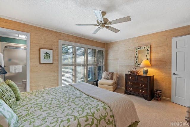 bedroom featuring a textured ceiling, light carpet, and ceiling fan